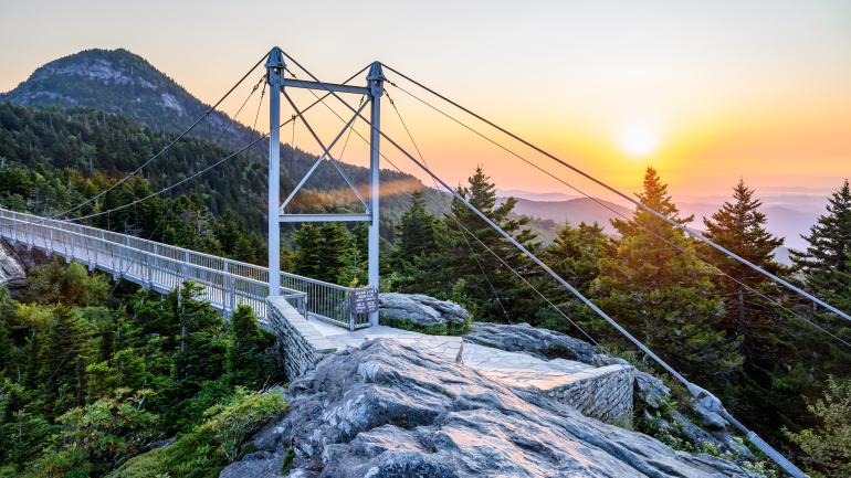 Breathtaking views of Grandfather Mountain at sunrise from the Mile High Swinging Bridge Breathtaking views of Grandfather Mountain at sunrise from the Mile High Swinging Bridge