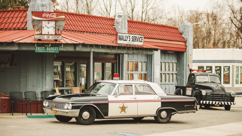 Vintage police car outside Wally's Service Station in Mount Airy, North Carolina Vintage police car outside Wally's Service Station in Mount Airy, North Carolina