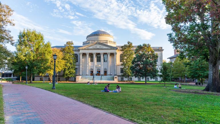 Students relaxing on a lawn at the University of North Carolina Chapel Hill Students relaxing on a lawn at the University of North Carolina Chapel Hill
