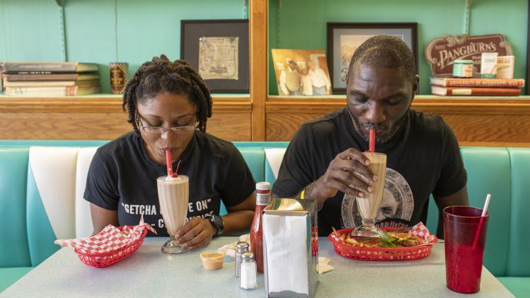 Enjoying old-fashioned milkshakes and diner fare at Brent’s Drugs in Jackson, Mississippi Enjoying old-fashioned milkshakes and diner fare at Brent’s Drugs in Jackson, Mississippi
