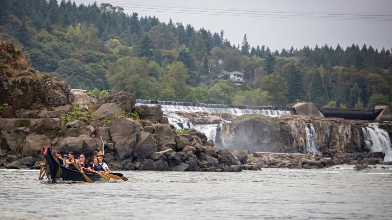 Members of the Confederated Tribes of Grand Ronde paddling on the Willamette River Members of the Confederated Tribes of Grand Ronde paddling on the Willamette River