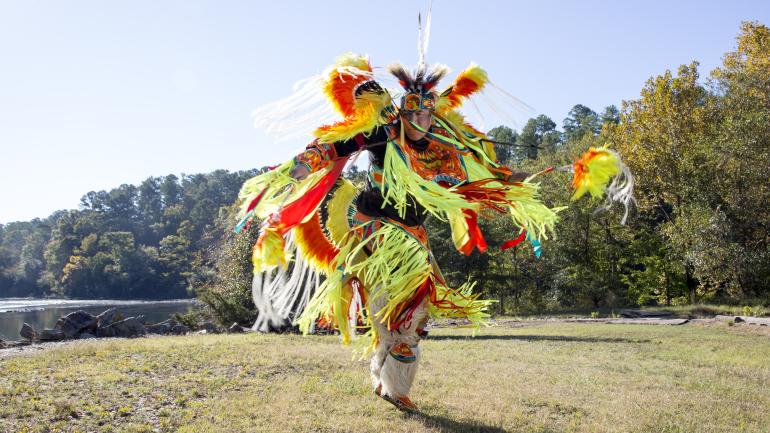 Colorfully dressed Cherokee dancer during a performance at a cultural festival in Oklahoma Colorfully dressed Cherokee dancer during a performance at a cultural festival in Oklahoma