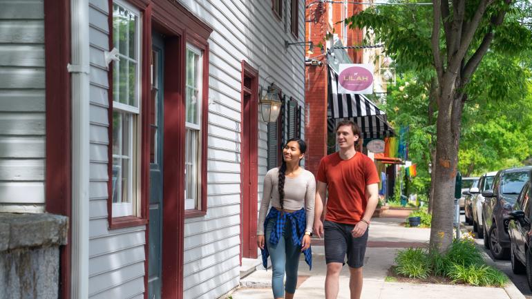 Walkers strolling through downtown Shepherdstown, West Virginia Walkers strolling through downtown Shepherdstown, West Virginia