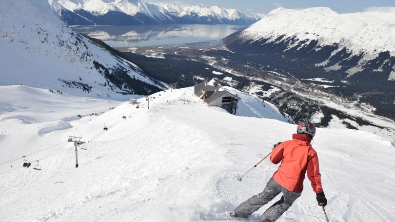 Downhill skiing amid breathtaking mountain scenery in Girdwood Downhill skiing amid breathtaking mountain scenery in Girdwood