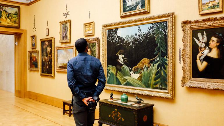 A patron admiring paintings at The Barnes Foundation A patron admiring paintings at The Barnes Foundation