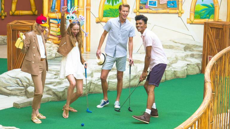 Friends playing an exciting game of Angry Birds Mini Golf Friends playing an exciting game of Angry Birds Mini Golf