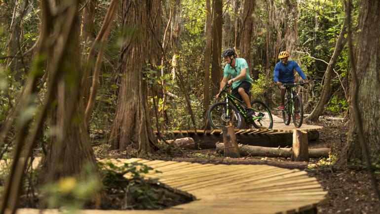 Riding the Hidden Lake Mountain Bike Trail, a guests-only trail near the JW Marriott Orlando, Grande Lakes Riding the Hidden Lake Mountain Bike Trail, a guests-only trail near the JW Marriott Orlando, Grande Lakes