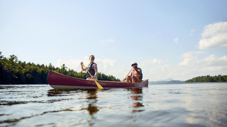 Kayakers taking in the stunning scenery in Peaks-Kenny State Park in Maine Kayakers taking in the stunning scenery in Peaks-Kenny State Park in Maine