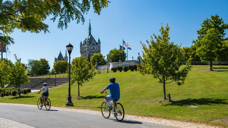 Cycling past historic architecture in Albany Cycling past historic architecture in Albany