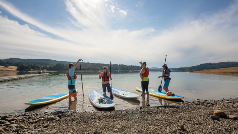 Stand-up paddleboarding on Henry Hagg Lake in Hillsboro, Oregon Stand-up paddleboarding on Henry Hagg Lake in Hillsboro, Oregon