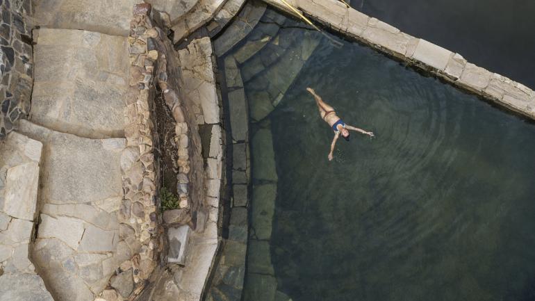 Bathing in natural pools at Strawberry Park Hot Springs Bathing in natural pools at Strawberry Park Hot Springs