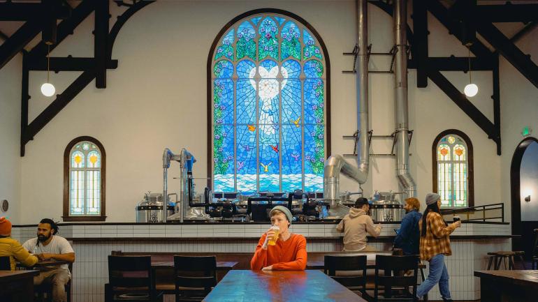 Sampling brews at Steeplejack Brewing Company, a taproom housed in a century-old church building Sampling brews at Steeplejack Brewing Company, a taproom housed in a century-old church building