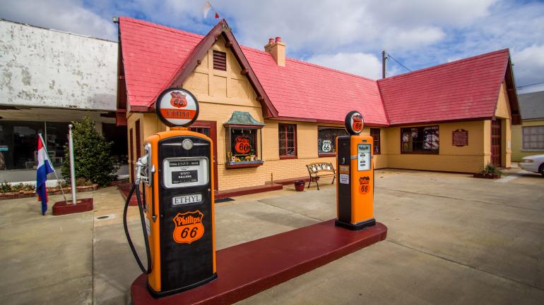 The house-like appearance and vintage gas pumps at the Kansas Route 66 Visitor Center in Baxter Springs The house-like appearance and vintage gas pumps at the Kansas Route 66 Visitor Center in Baxter Springs