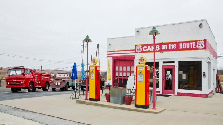 Service station and car garage painted white with red doors and trim known as Cars on the Route in Galena, Kansas Service station and car garage painted white with red doors and trim known as Cars on the Route in Galena, Kansas
