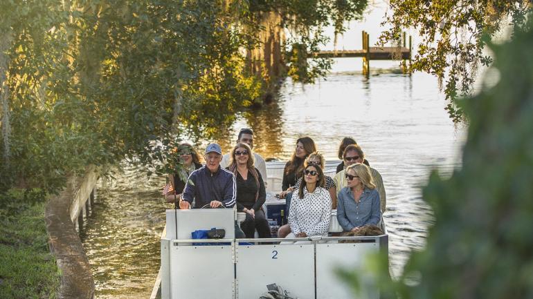 Sailing through peaceful canals on the Winter Park Boat Tour Sailing through peaceful canals on the Winter Park Boat Tour