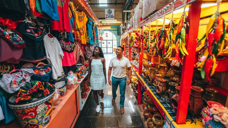 A young couple wander a vibrant market in San Antonio A young couple wander a vibrant market in San Antonio