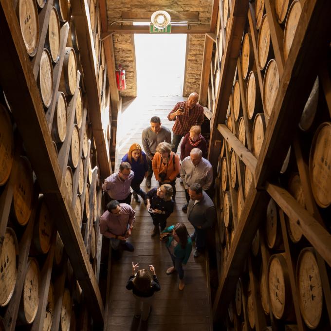 Layers of bourbon barrels aging in a rickhouse Layers of bourbon barrels aging in a rickhouse
