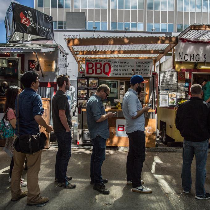 People queuing at one of Portland’s popular food carts People queuing at one of Portland’s popular food carts