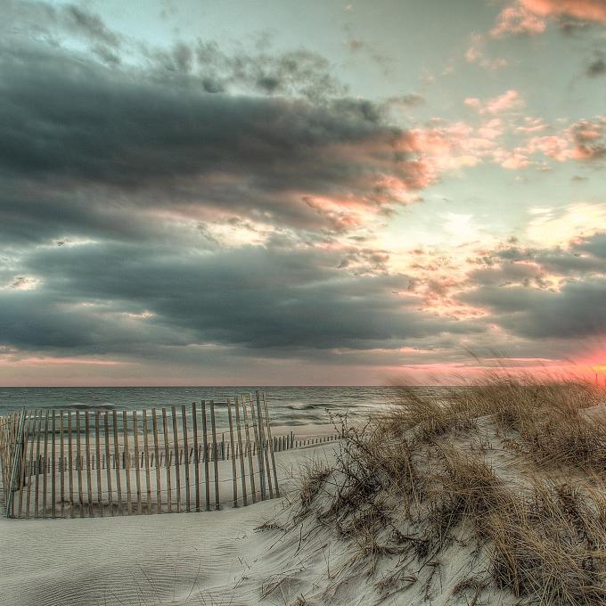 Storm clouds over the beach at sunset Storm clouds over the beach at sunset
