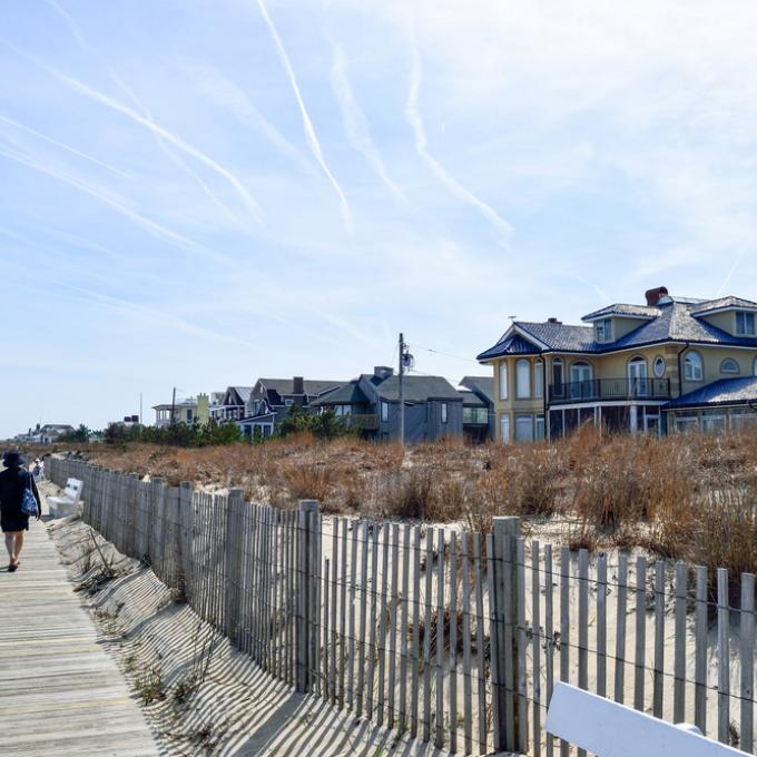 Strolling the beachfront boardwalk in Rehoboth Beach, Delaware Strolling the beachfront boardwalk in Rehoboth Beach, Delaware