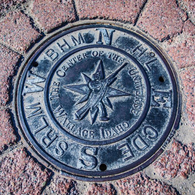 Manhole cover representing the ‘Center of the Universe’ in Wallace, Idaho Manhole cover representing the ‘Center of the Universe’ in Wallace, Idaho