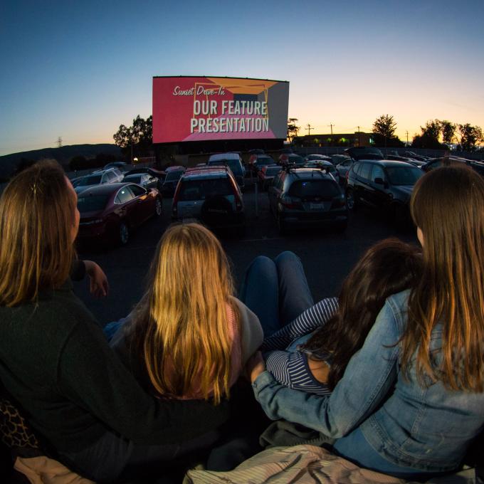 Watching a twilight movie at the Sunset Drive-In Watching a twilight movie at the Sunset Drive-In