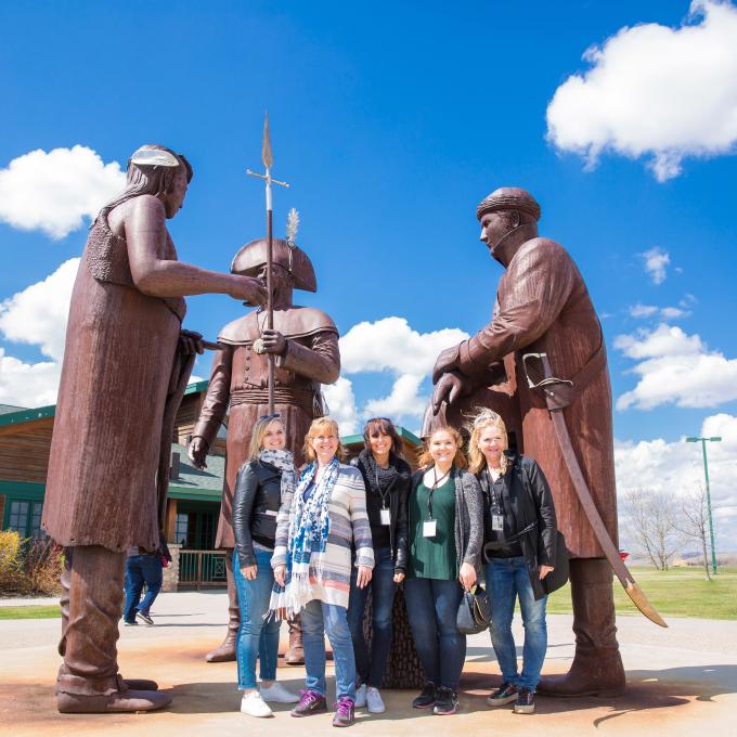 Posing with statues at the Lewis and Clark Interpretive Center in North Dakota Posing with statues at the Lewis and Clark Interpretive Center in North Dakota