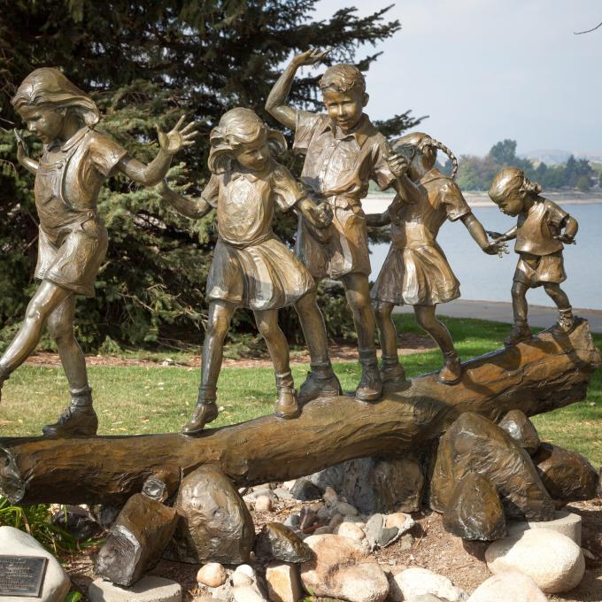 A bronze sculpture on the banks of Lake Loveland in Colorado A bronze sculpture on the banks of Lake Loveland in Colorado