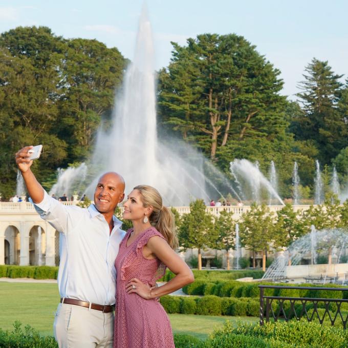 Couple taking a selfie in front of fountains at Longwood Gardens in Kennett Square, Pennsylvania Couple taking a selfie in front of fountains at Longwood Gardens in Kennett Square, Pennsylvania