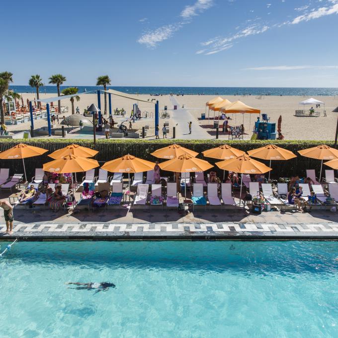 View of the pool at the Annenberg Community Beach House in Santa Monica, California, overlooking the beach View of the pool at the Annenberg Community Beach House in Santa Monica, California, overlooking the beach