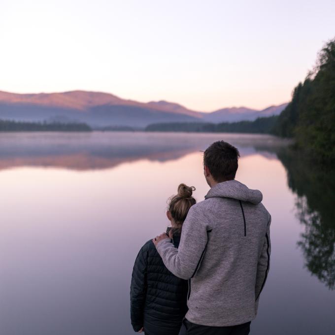 Couple appreciating views of Lake Koocanusa in Montana Couple appreciating views of Lake Koocanusa in Montana