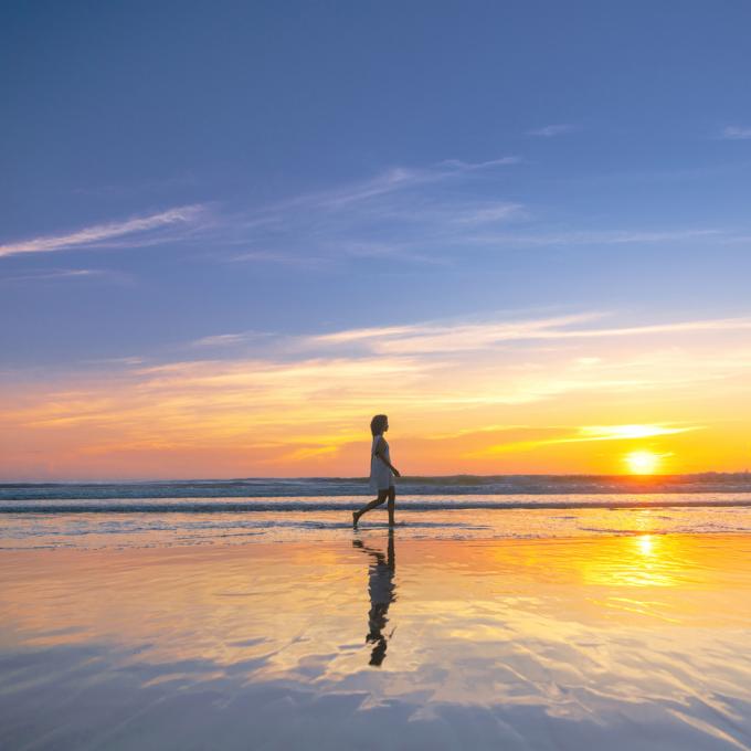 Walking along the shore at Daytona Beach, Florida Walking along the shore at Daytona Beach, Florida