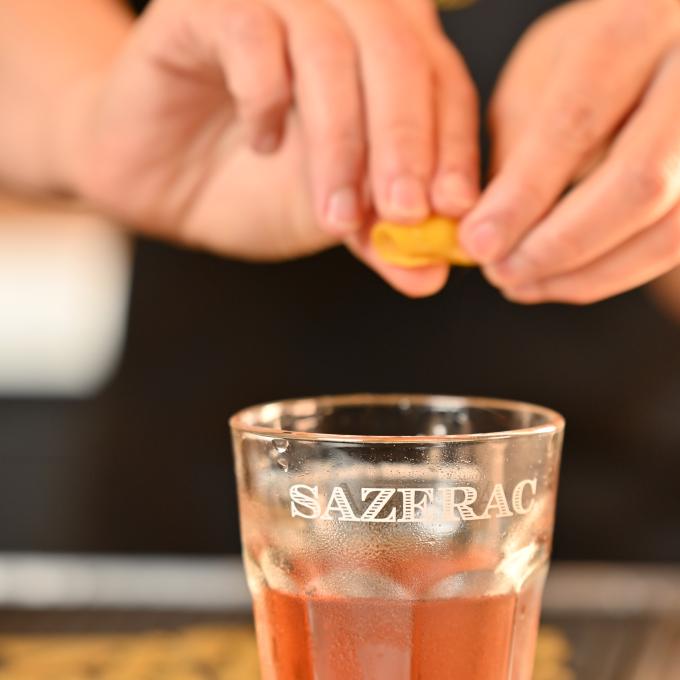 Bartender putting the finishing touches on a cocktail at The Sazerac House in New Orleans, Louisiana Bartender putting the finishing touches on a cocktail at The Sazerac House in New Orleans, Louisiana