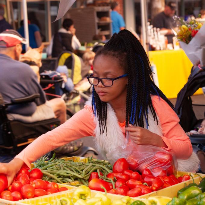 Browsing fresh produce at an Oregon farmers market Browsing fresh produce at an Oregon farmers market