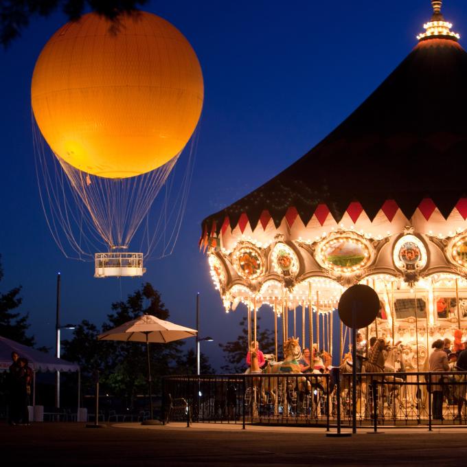 Night falls on the Spectrum Center Carousel and the Great Park Balloon in Irvine, California Night falls on the Spectrum Center Carousel and the Great Park Balloon in Irvine, California