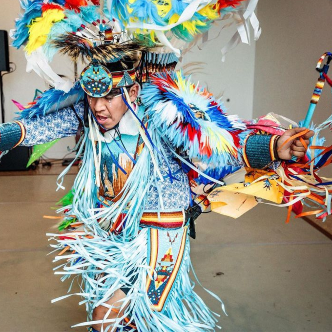 A colorfully dressed dancer participates in a sovereign nation celebration at Gathering Place in Tulsa, Oklahoma A colorfully dressed dancer participates in a sovereign nation celebration at Gathering Place in Tulsa, Oklahoma