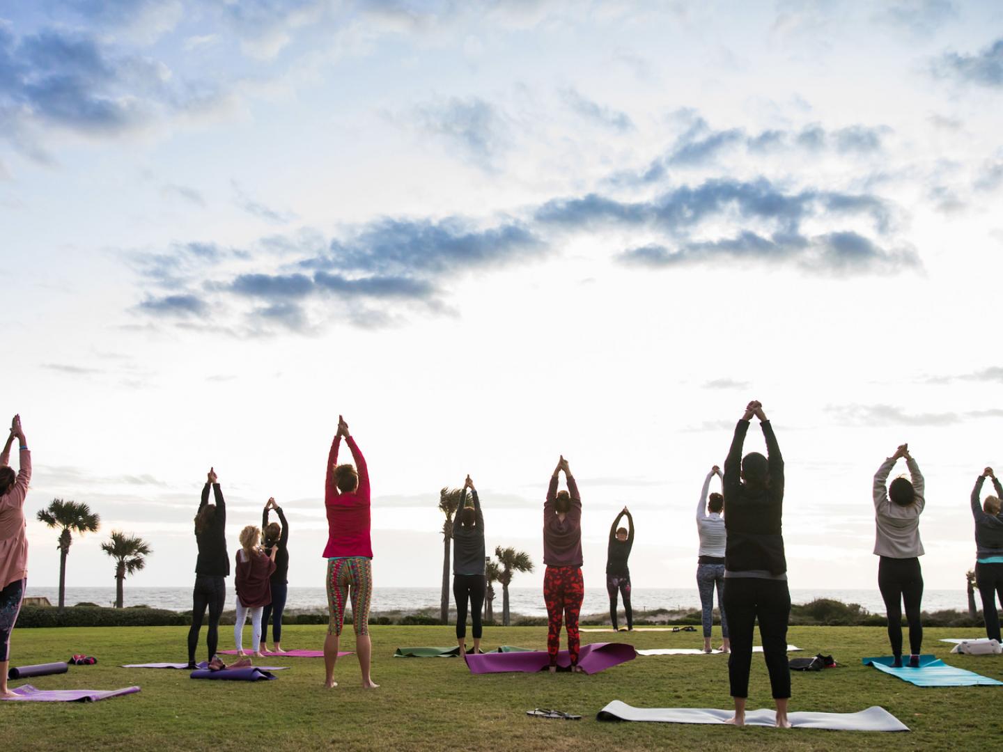 Beachfront yoga during the Amelia Island Wellness Festival Beachfront yoga during the Amelia Island Wellness Festival