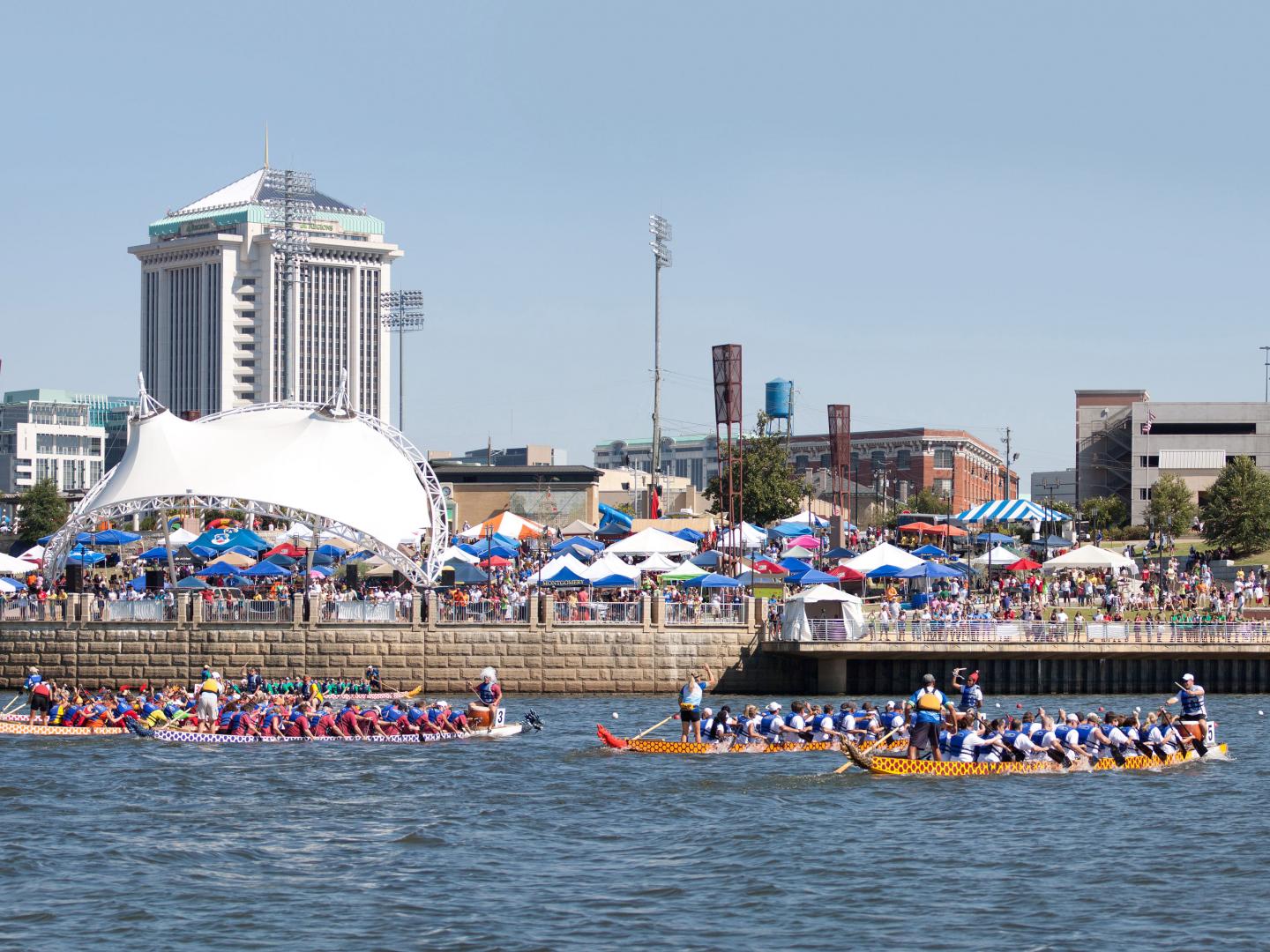 Teams racing dragon boats in the Alabama River Teams racing dragon boats in the Alabama River