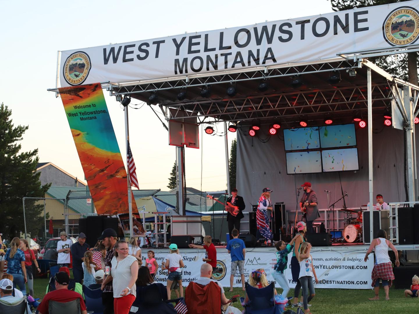Catching a live concert during Music in the Park in West Yellowstone, Montana Catching a live concert during Music in the Park in West Yellowstone, Montana