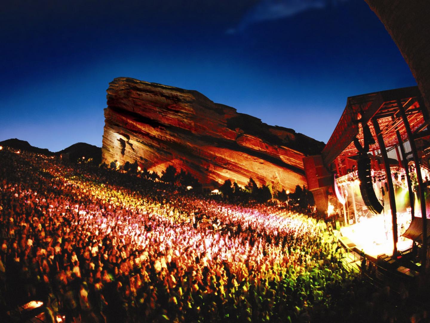 Full tilt in the electric glow of a concert at Red Rocks Amphitheater Full tilt in the electric glow of a concert at Red Rocks Amphitheater