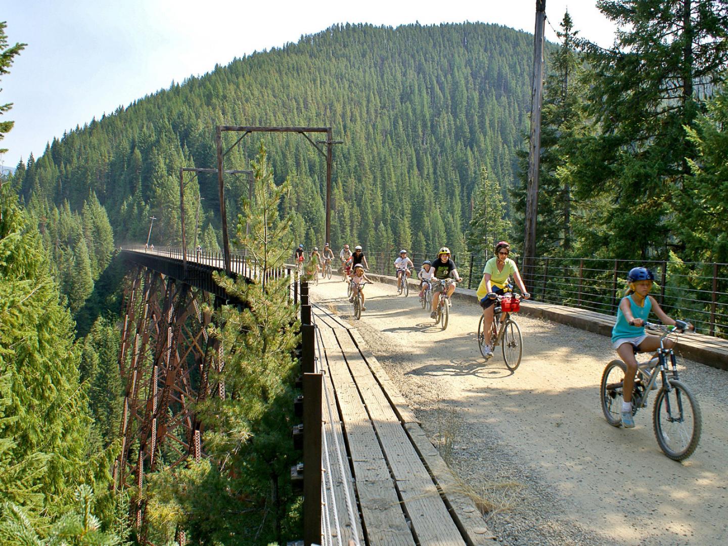 Family cycling along the Route of the Hiawatha near Wallace Idaho Family cycling along the Route of the Hiawatha near Wallace Idaho