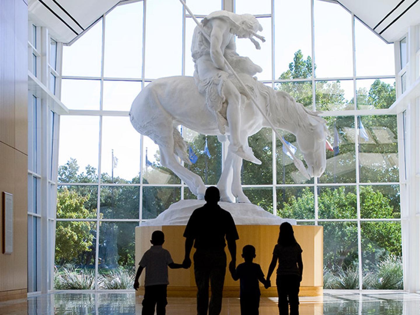 Family browsing exhibits at the National Cowboy & Western Heritage Museum Family browsing exhibits at the National Cowboy & Western Heritage Museum