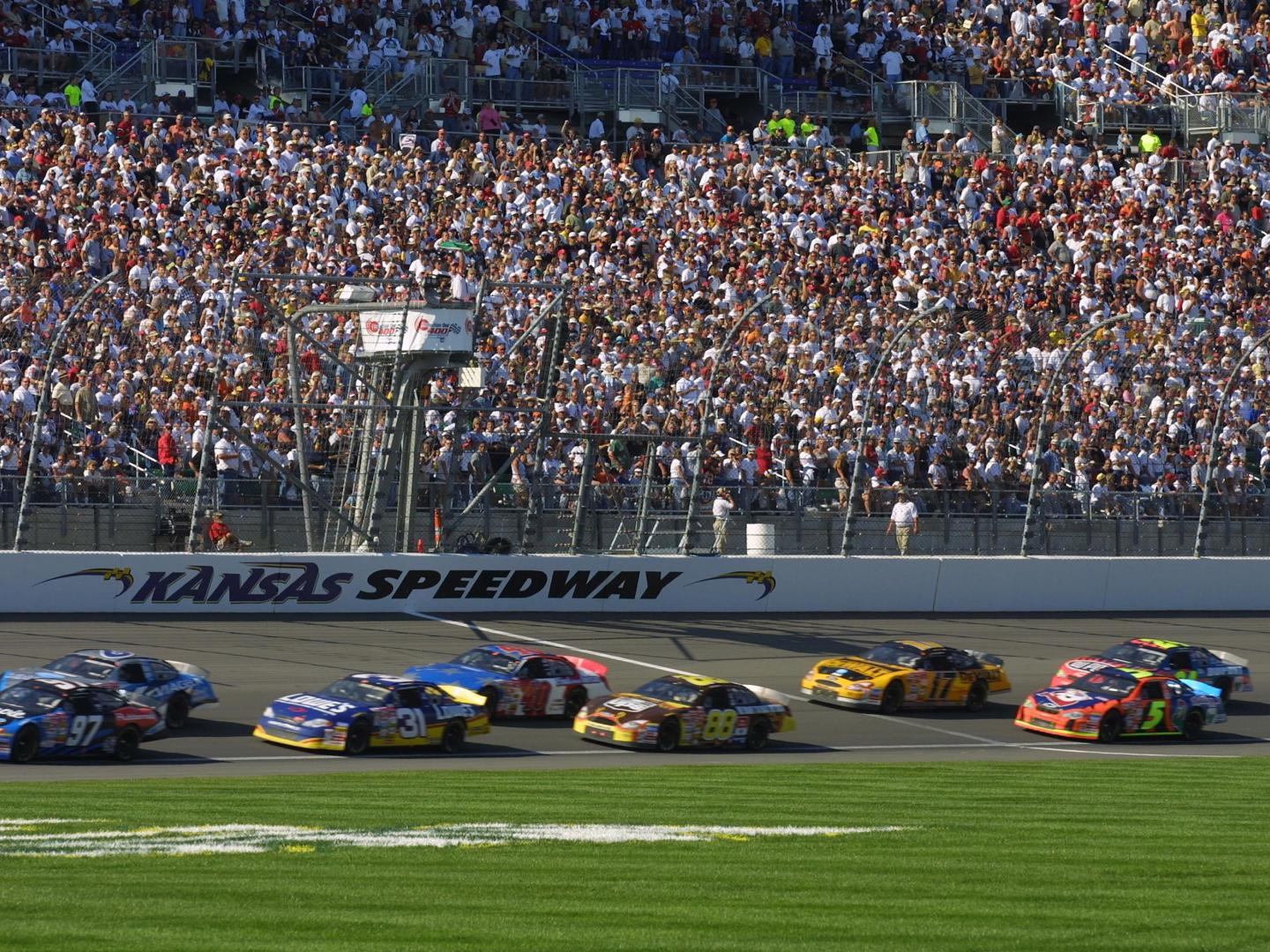 Stock cars racing at the Kansas Speedway in Kansas City Stock cars racing at the Kansas Speedway in Kansas City