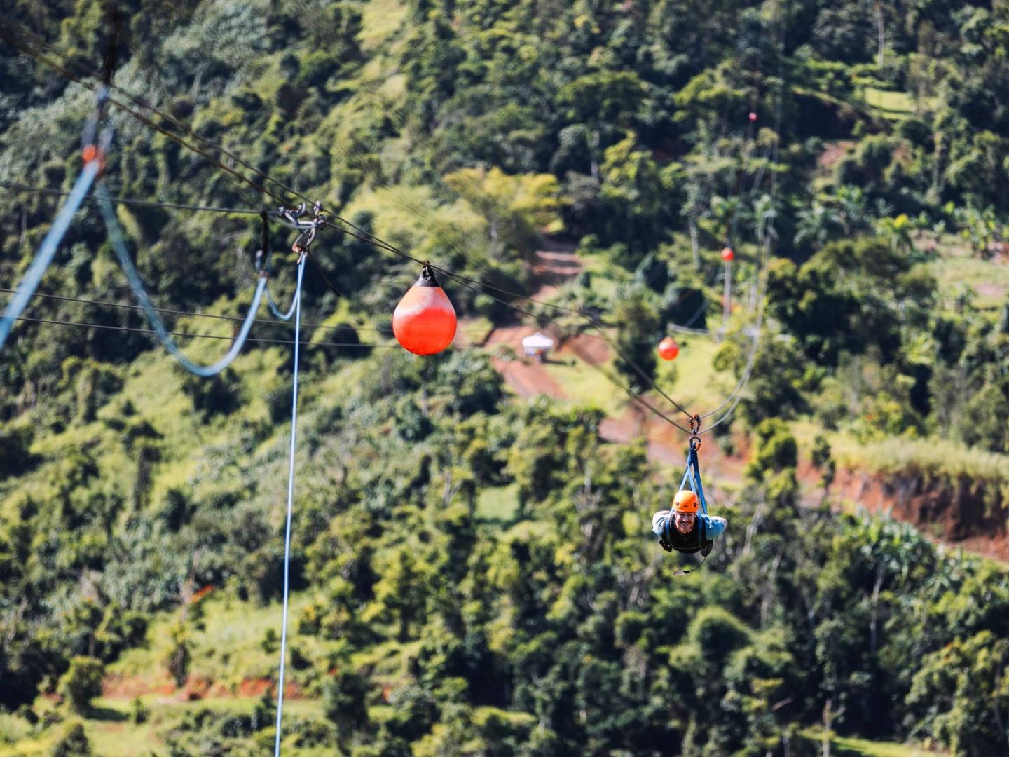Soaring over the landscape on The Monster zip line in Toro Verde Nature Adventure Park in Puerto Rico Soaring over the landscape on The Monster zip line in Toro Verde Nature Adventure Park in Puerto Rico