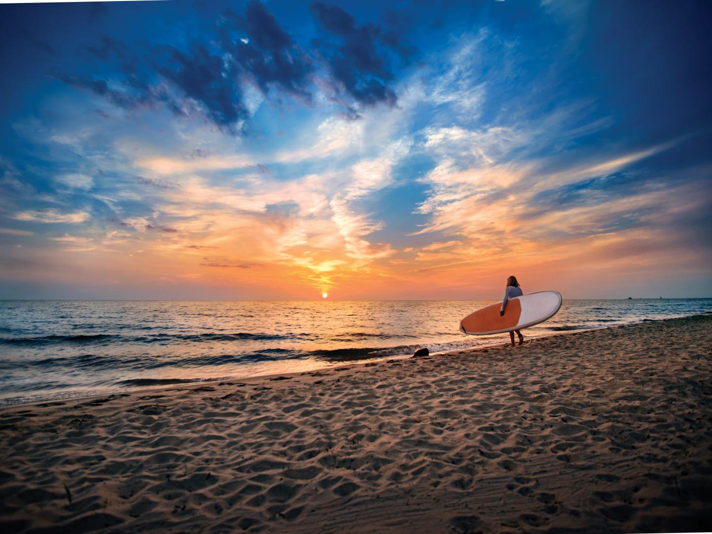 Heading out for a sunset paddle at Grand Haven State Park in Michigan Heading out for a sunset paddle at Grand Haven State Park in Michigan
