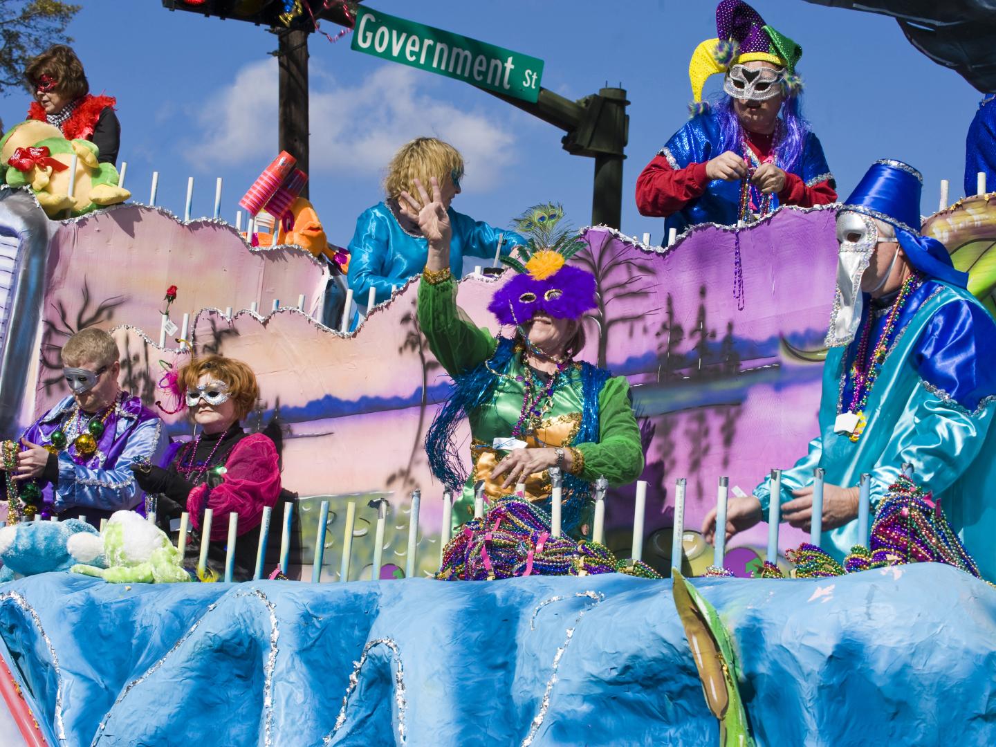 A float with costumed revelers during a Mardi Gras parade in Mobile, Alabama A float with costumed revelers during a Mardi Gras parade in Mobile, Alabama