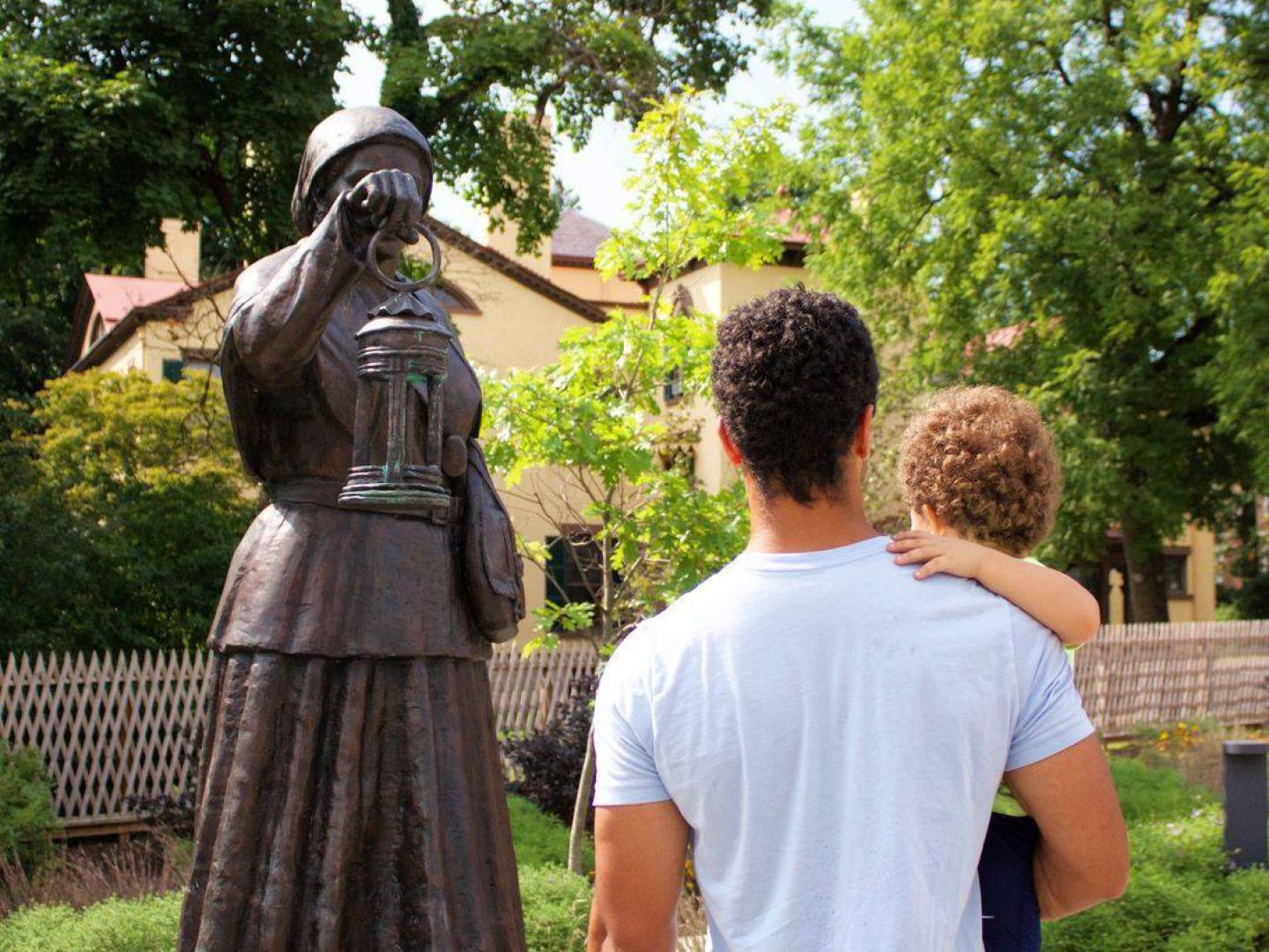 Admiring a statue of Harriet Tubman at the Harriet Tubman Home in Auburn, New York Admiring a statue of Harriet Tubman at the Harriet Tubman Home in Auburn, New York