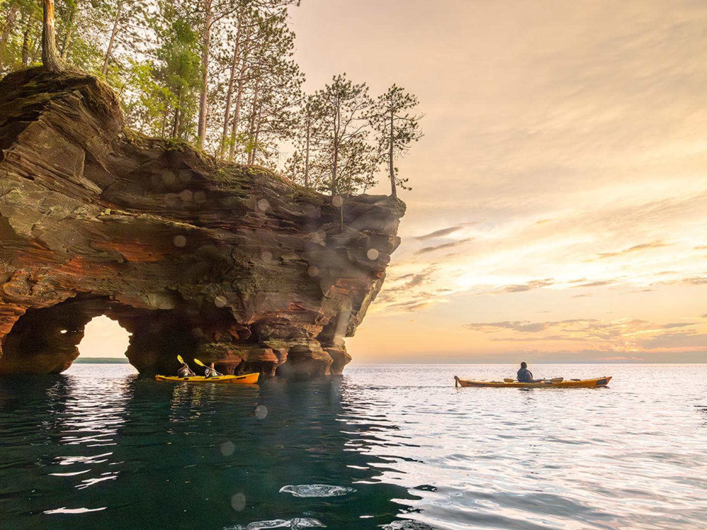 Kayaking through sea caves in Apostle Islands National Lakeshore in Wisconsin Kayaking through sea caves in Apostle Islands National Lakeshore in Wisconsin