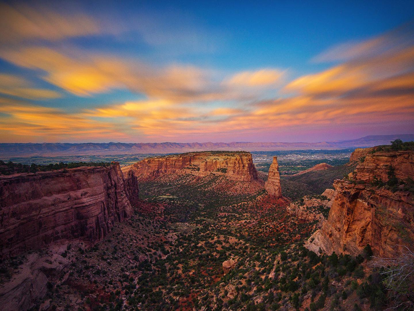 A colorful sunset over the Colorado National Monument near Grand Junction, Colorado A colorful sunset over the Colorado National Monument near Grand Junction, Colorado