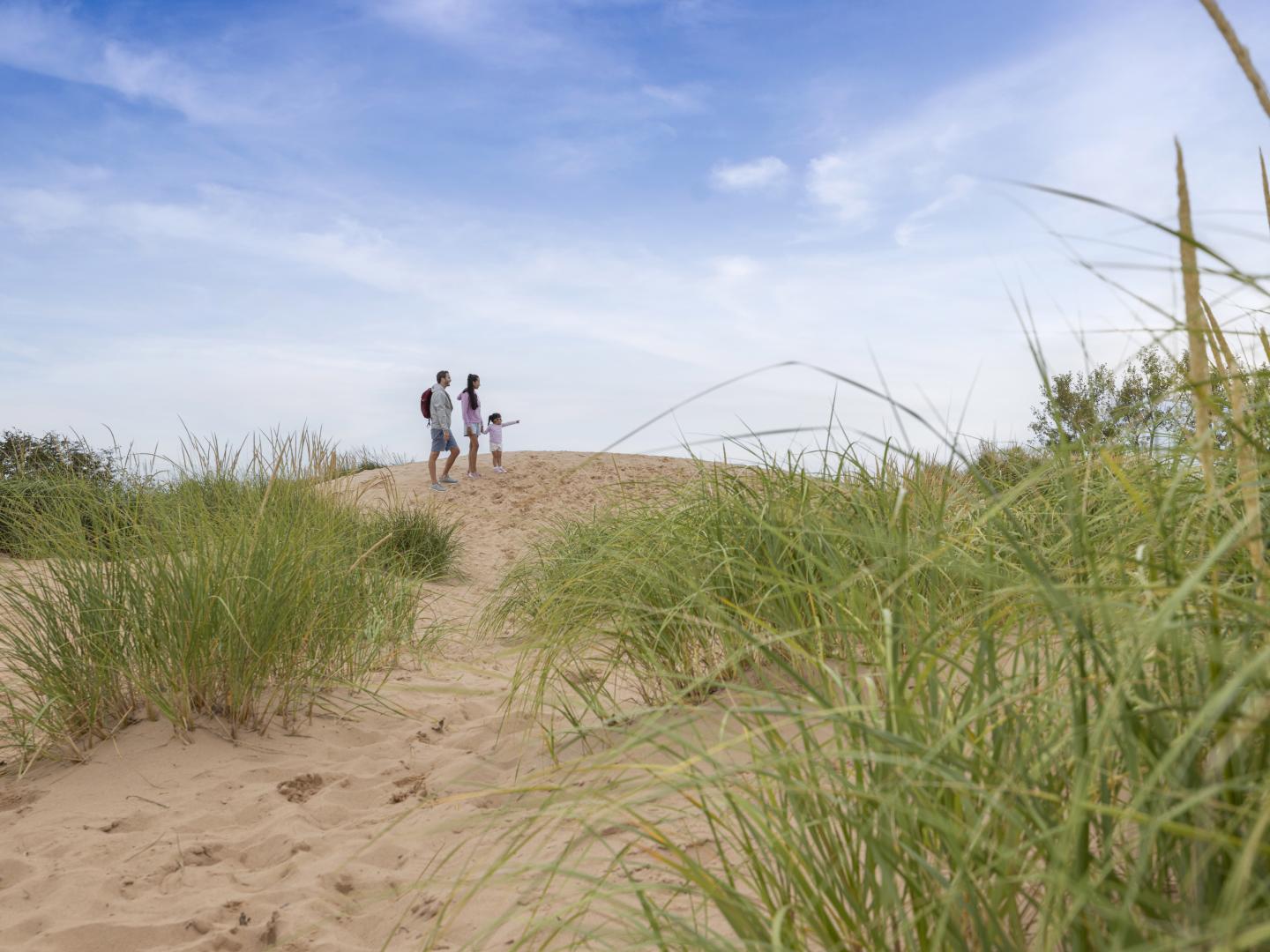 Family hiking on the Sleeping Bear Dunes National Seashore near Traverse City, Michigan Family hiking on the Sleeping Bear Dunes National Seashore near Traverse City, Michigan